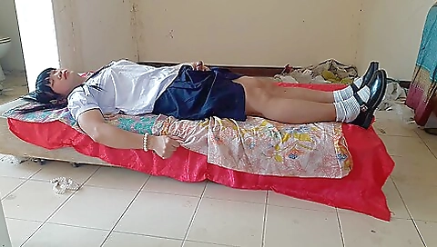 Amateur schoolgirl wearing school uniform in the school garden