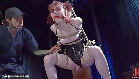 Red-haired slave girl in a high-quality bondage video
