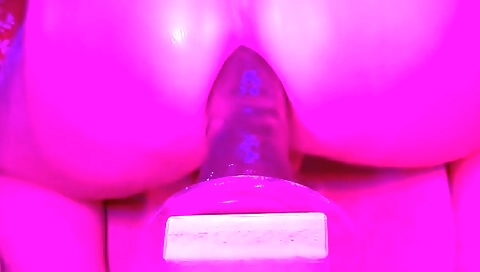 Busty blonde with a sexy ass takes a big dildo to her ass