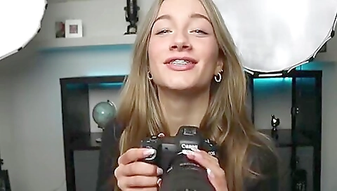 Sexy brunette girl in a white t-shirt and pink shorts