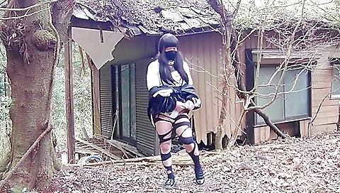 Brunette in sexy black dress masturbating in an abandoned house