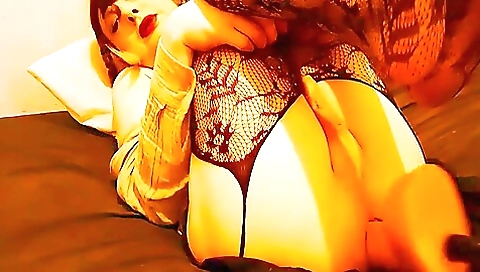 Hot brunette plays with her pussy while wearing stockings